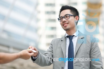 Businesspeople Exchanging Cards Stock Photo