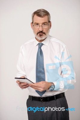 Businessperson Using Touch Pad Device Stock Photo