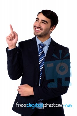 Businesss Executive Pointing Upwards Stock Photo