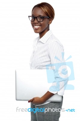 Businesswoman Carrying Laptop Stock Photo