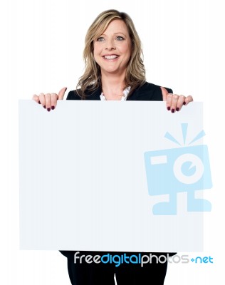 Businesswoman Holding Billboard Stock Photo