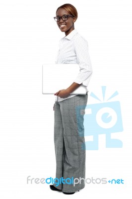 Businesswoman Holding Laptop Stock Photo