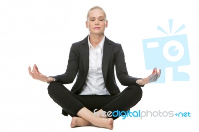 Businesswoman In Yoga Position Stock Photo