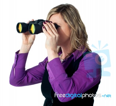 Businesswoman Looking Through Binoculars Stock Photo