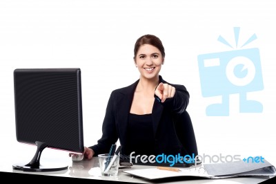 Businesswoman Pointing At The Viewer In Her Office Stock Photo