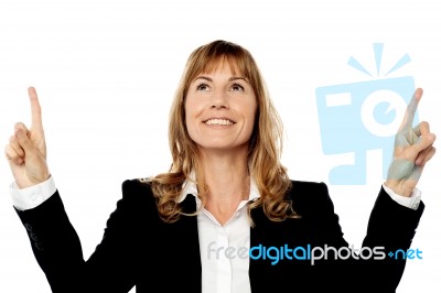 Businesswoman Pointing Upwards Stock Photo