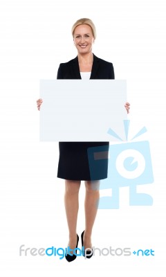 Businesswoman Showing Blank White Billboard Stock Photo