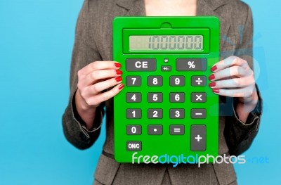 Businesswoman Showing Calculator Stock Photo