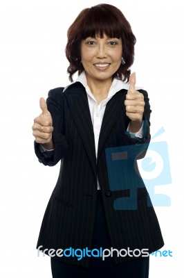 Businesswoman Showing Thumbs Up Stock Photo