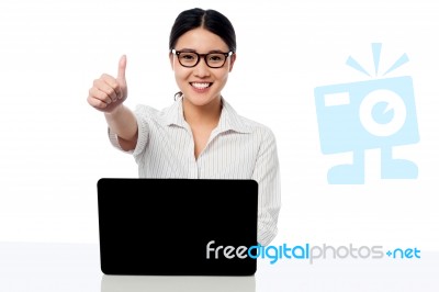 Businesswoman Showing Thumbs Up Gesture Stock Photo