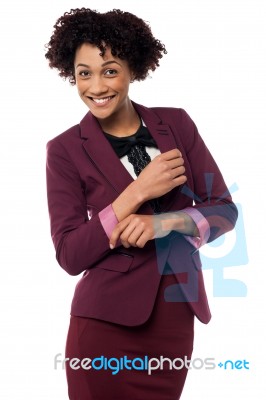 Businesswoman Striking Stylish Pose, Confidently Stock Photo