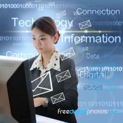 Businesswoman Typing On desktop Stock Photo