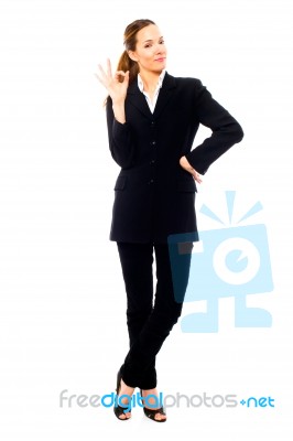 Businesswoman With Ok Gesture Stock Photo