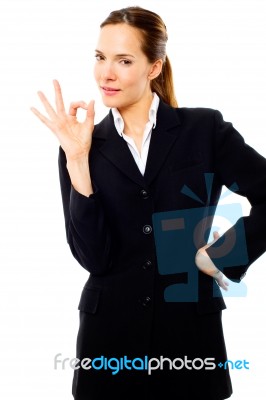 Businesswoman With Ok Gesture Stock Photo