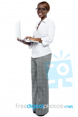 Businesswoman Working On Laptop Stock Photo