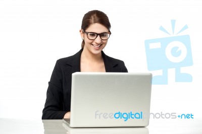 Businesswoman Working On Laptop Stock Photo