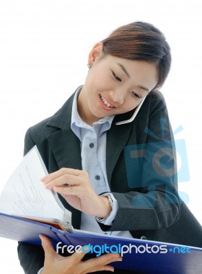 Businesswoman Working On Phone Stock Photo