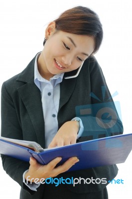 Businesswoman Working On Phone Stock Photo