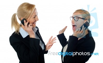 Businesswomen On Cellphones Stock Photo