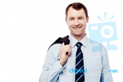 Bussiness Man With Coat On Shoulder Stock Photo