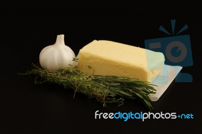 Butter Herb Thyme Rosemary Garlic  Black Background Stock Photo