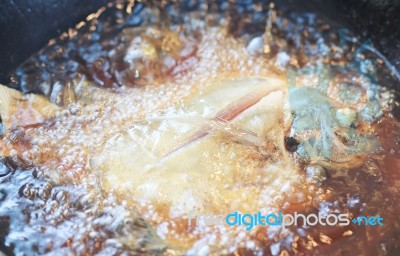 Butterfish Frying In Hot Oil Stock Photo