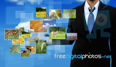 Button Streaming Multimedia In Hand On Blue Sky Stock Photo