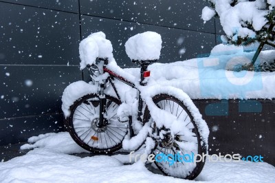 Bycicle Covered By Snow Stock Photo