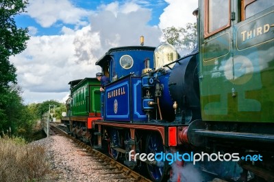 C Class And Bluebell Steam Engines Leaving Sheffield Park Station Stock Photo