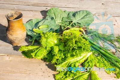 Cabbage, Onions, Cucumbers And Vintage Jug On The Wooden Table Stock Photo