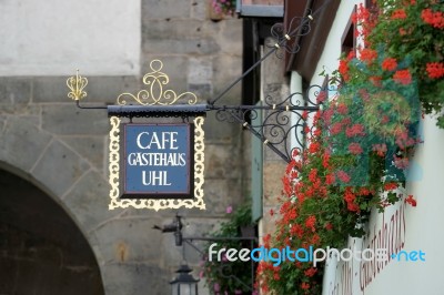 Cafe Gatehaus Uhl Hanging Sign In Rothenburg Stock Photo