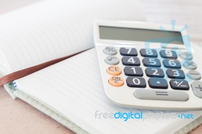 Calculator On Blank Notebook Stock Photo