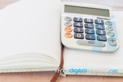 Calculator On Blank Notebook Stock Photo