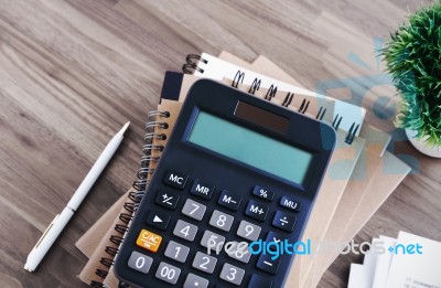 Calculator On Office Desk Background Stock Photo