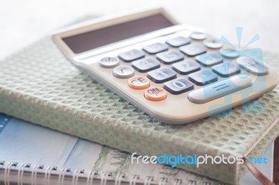 Calculator On Two Of Notebooks Stock Photo