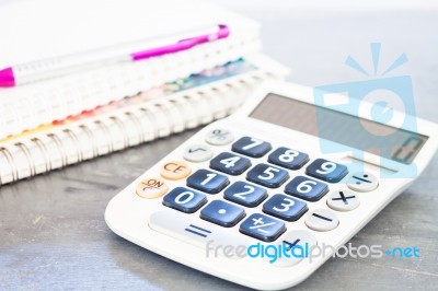 Calculator, Pen And Notepad For Notes Stock Photo