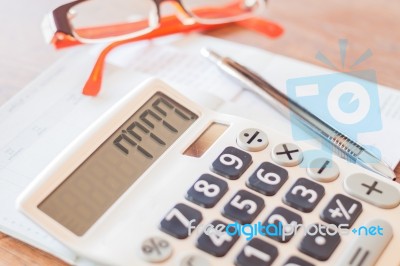 Calculator, Pen And On Bank Account Passbook Stock Photo