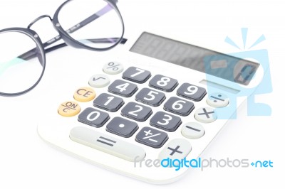 Calculator With Eyeglasses Isolated On White Background Stock Photo