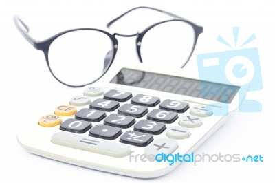 Calculator With Eyeglasses Isolated On White Background Stock Photo