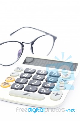 Calculator With Eyeglasses Isolated On White Background Stock Photo