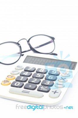 Calculator With Eyeglasses Isolated On White Background Stock Photo