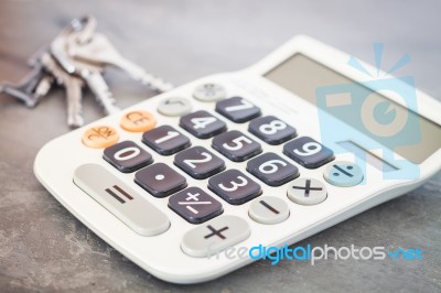 Calculator With Keys On Grey Background Stock Photo