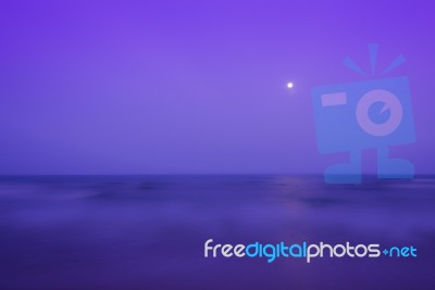 Calm Sea And Full Moon Sky Stock Photo