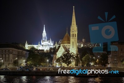 Calvinist And Matthias Churches Illuminated In Budapest Stock Photo