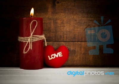 Candle Light With Red Heart Symbol Background Stock Photo