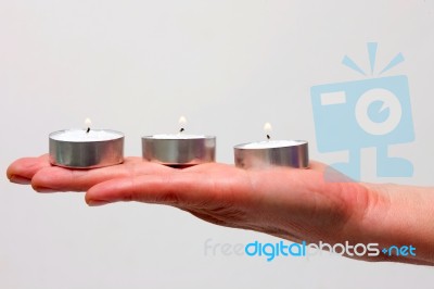 Candles On Hand Stock Photo