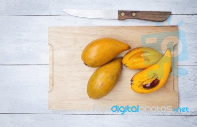 Canistel Fruit On Wooden Cutting Board Stock Photo