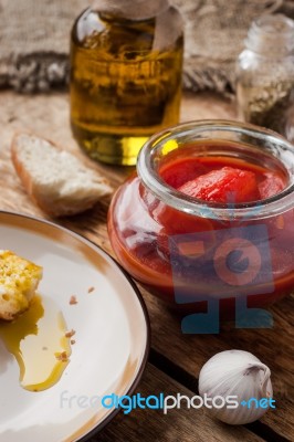 Canned Tomatoes In A Glass Jar Stock Photo