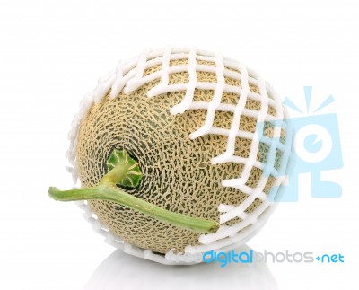 Cantaloupe In Net Bag, Isolated On White Background Stock Photo