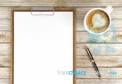 Cappuccino Coffee Cup With Blank Papers On Clipboard And Ballpoint Pen On Wooden Background, Coffee And Business Background Stock Image